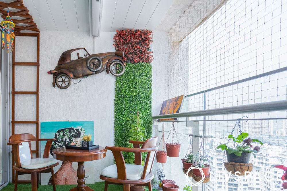 small-balcony-design-mumbai-with-quirky-decor-and-plants