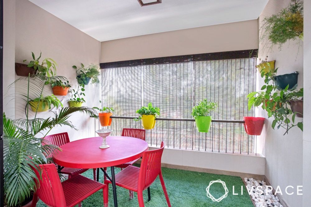 small-balcony-design-with-red-table-and-chairs