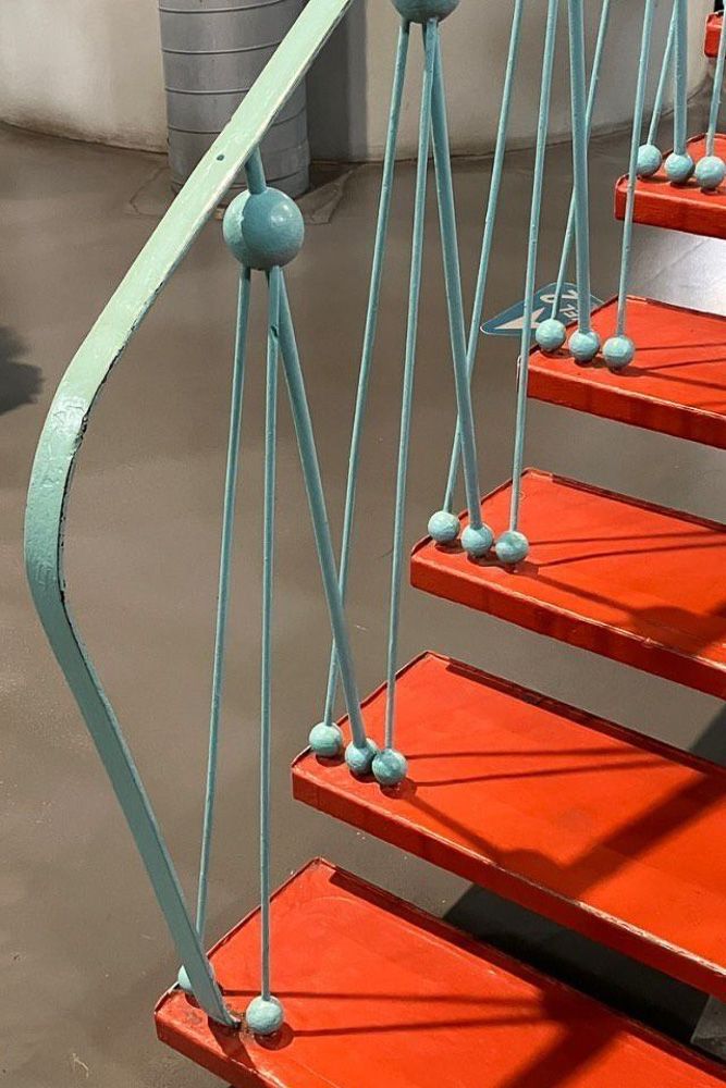 newton cradle inspired metal handrail design