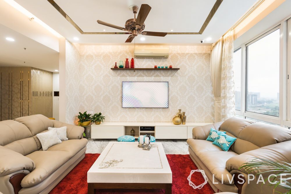 white-and-gold-tv-console-design-in-neutral-living-room-with-red-rug