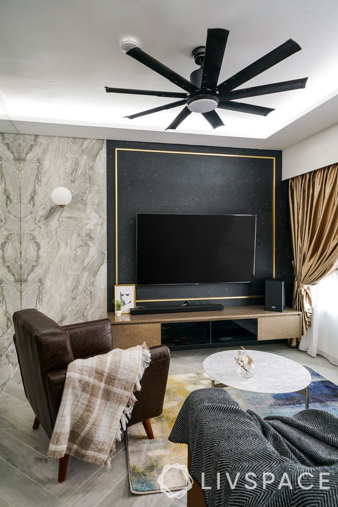 black-tv-cabinet-design-for-living-room-with-gold-trims