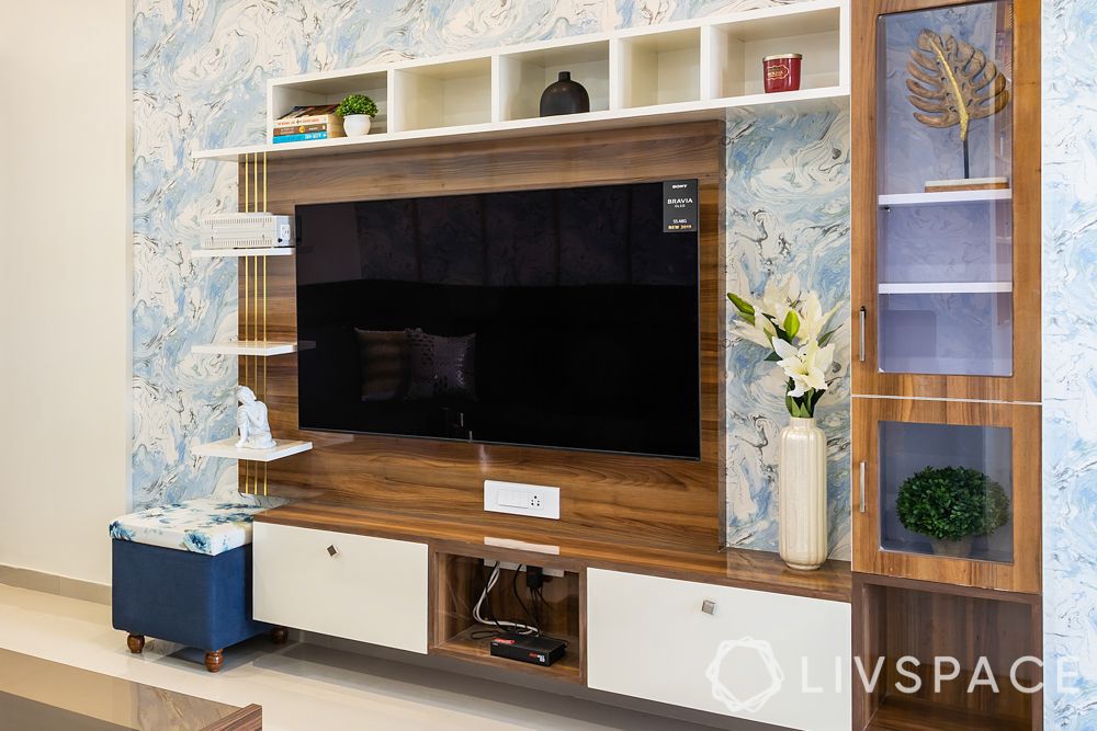 wood-modular-tv-unit-design-against-blue-floral-wallpaper