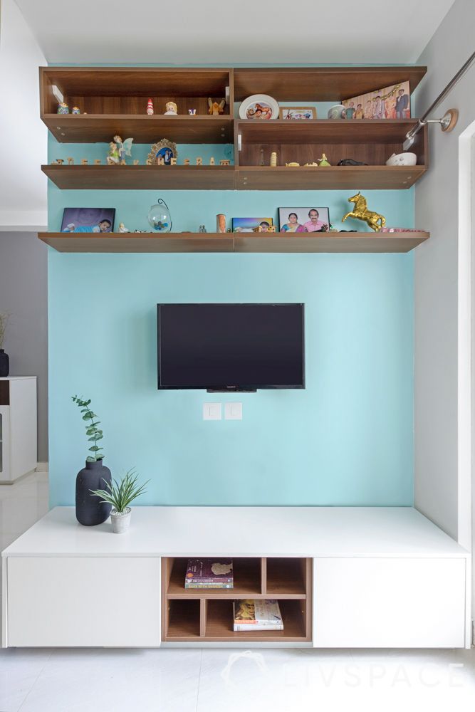 tv-panel-design-against-blue-wall-with-racks