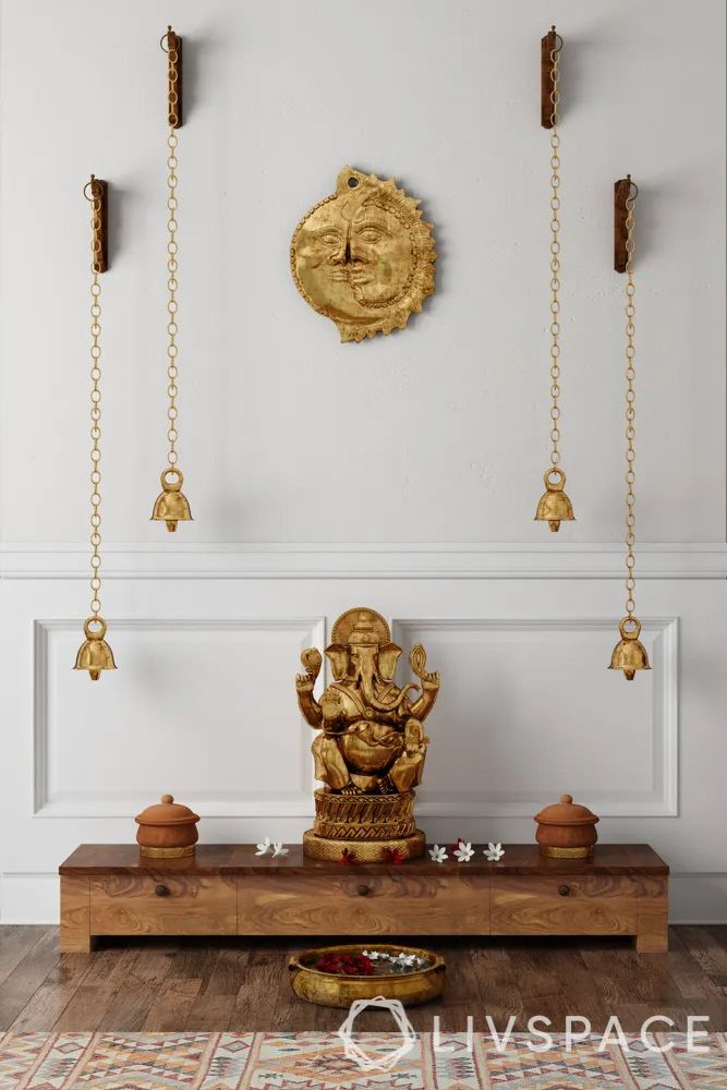 small-hindu-temple-design-for-home-against-wall-with-hanging-bells