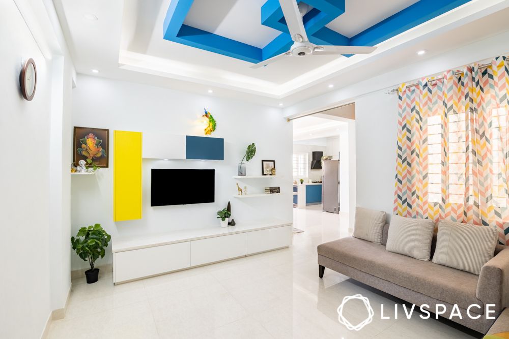 white-living-room-in-interior-design-for-rsun-clover-apartment-with-blue-false-ceiling