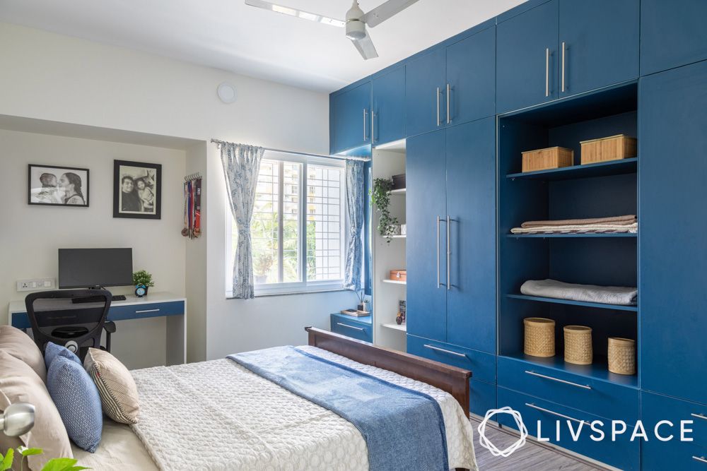 3bhk-interior-design-in-subramanyapura-bengaluru-with-master-bedroom-and-blue-wardrobe