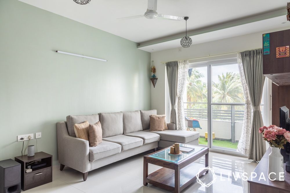 living-room-in-3bhk-home-interior-design-subramanyapura-bengaluru-with-grey-sofa