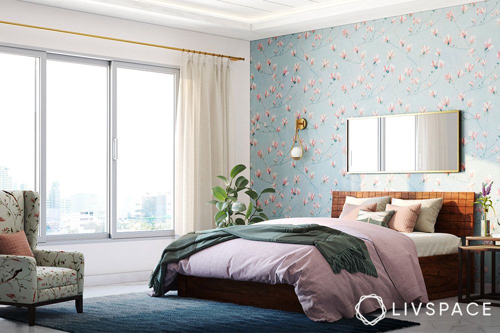 bedroom-with-blue-tropical-floral-wallpaper-and-accent-chair