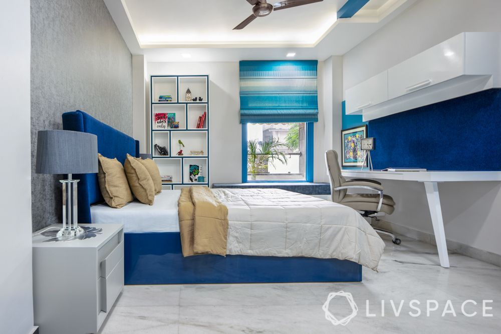 white-peripheral-false-ceiling-in-blue-bedroom