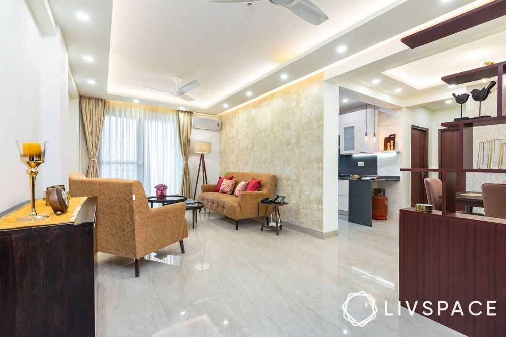 3-bhk-interior-design-living-room-sofas-false-ceiling-wallpaper