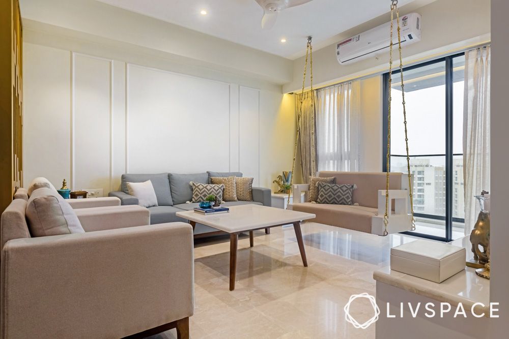 3bhk-cost-minimal-living-room-wall-moulding-beige-sofa-jhoola