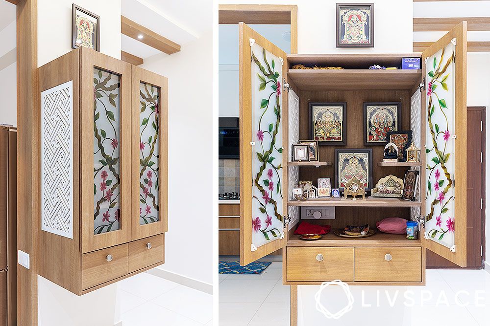 wall-mounted-pooja-unit-with-frosted-glass-doors-and-floral-motifs