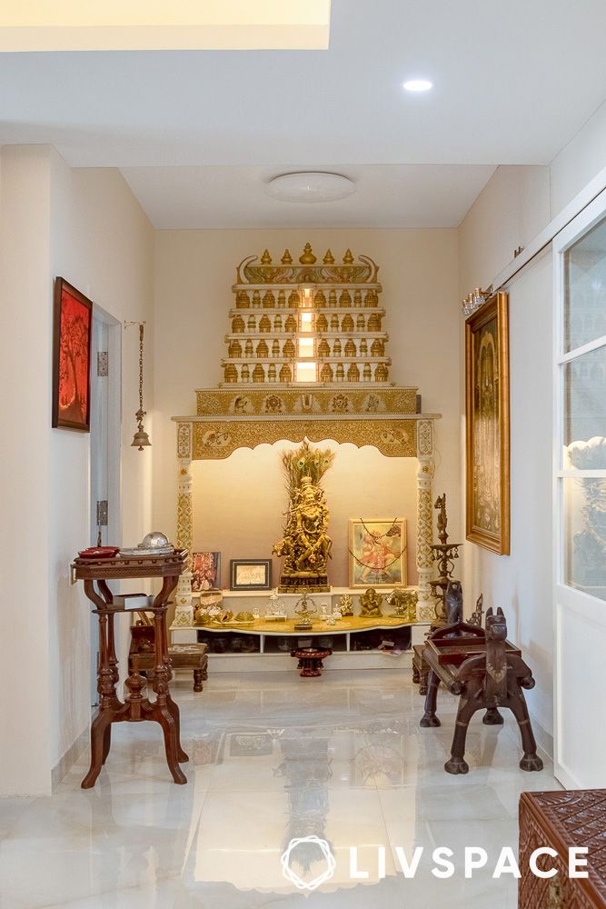 hindu-marble-pooja-room-design-with-gold-motifs