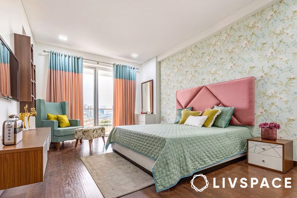 green bedroom colours with printed wallpaper