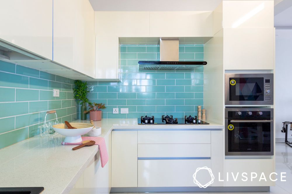glossy-white-kitchen-design-with-aqua-blue-backsplash