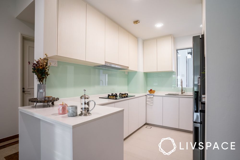 white-kitchen-design-with-mint-green-glass-backsplash