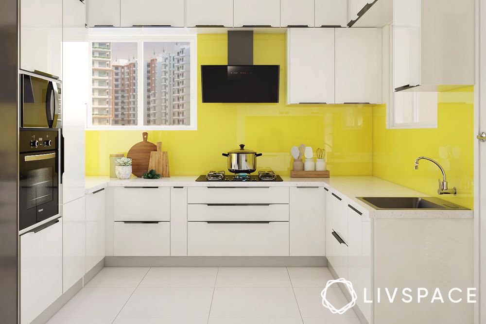 https://jumanji.livspace-cdn.com/magazine/wp-content/uploads/sites/2/2023/04/13123204/yellow-and-white-kitchen.jpg