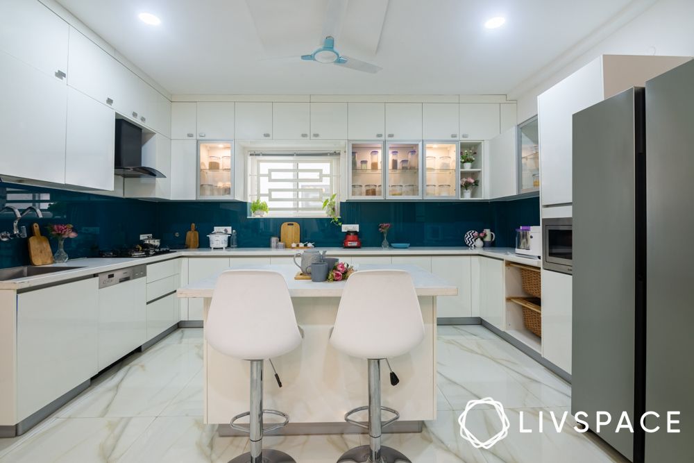 white-kitchen-design-with-blue-glass-dado-breakfast-bar