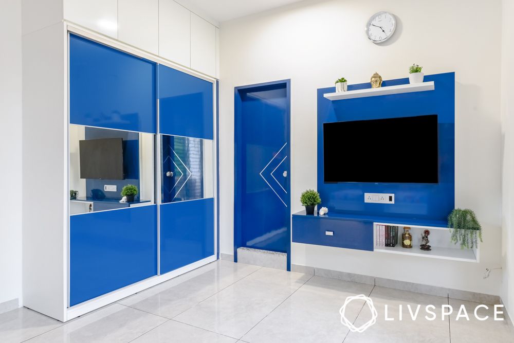 3bhk-interior-design-cost-in-ahmedabad-with-blue-wardrobe-tv-unit