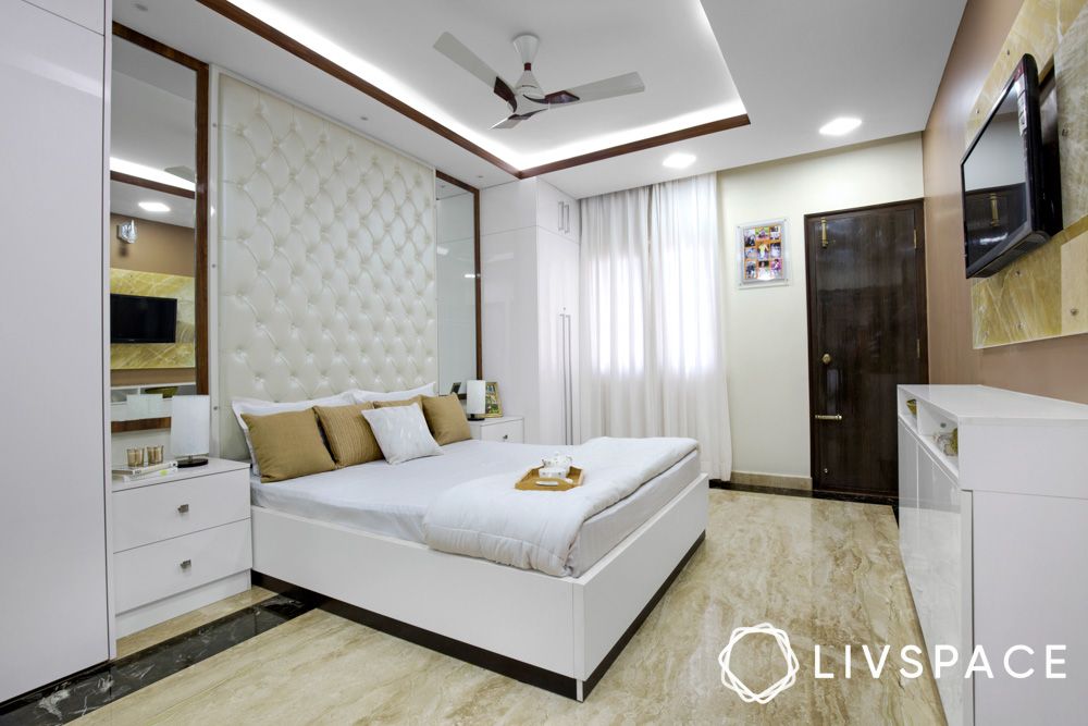 white-bedroom-with-headboard-wall-granite-flooring-false-ceiling 
