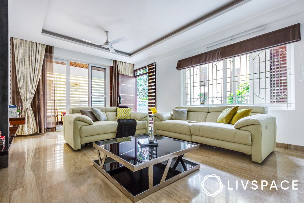 granite-floor-tiles-in-living-room-with-beige-sofa-and-centre-table