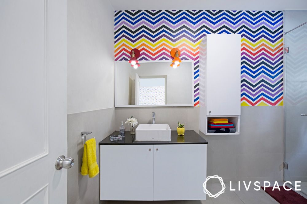 white-wall-mounted-and-base-bathroom-cabinet-with-colourful-wallpaper