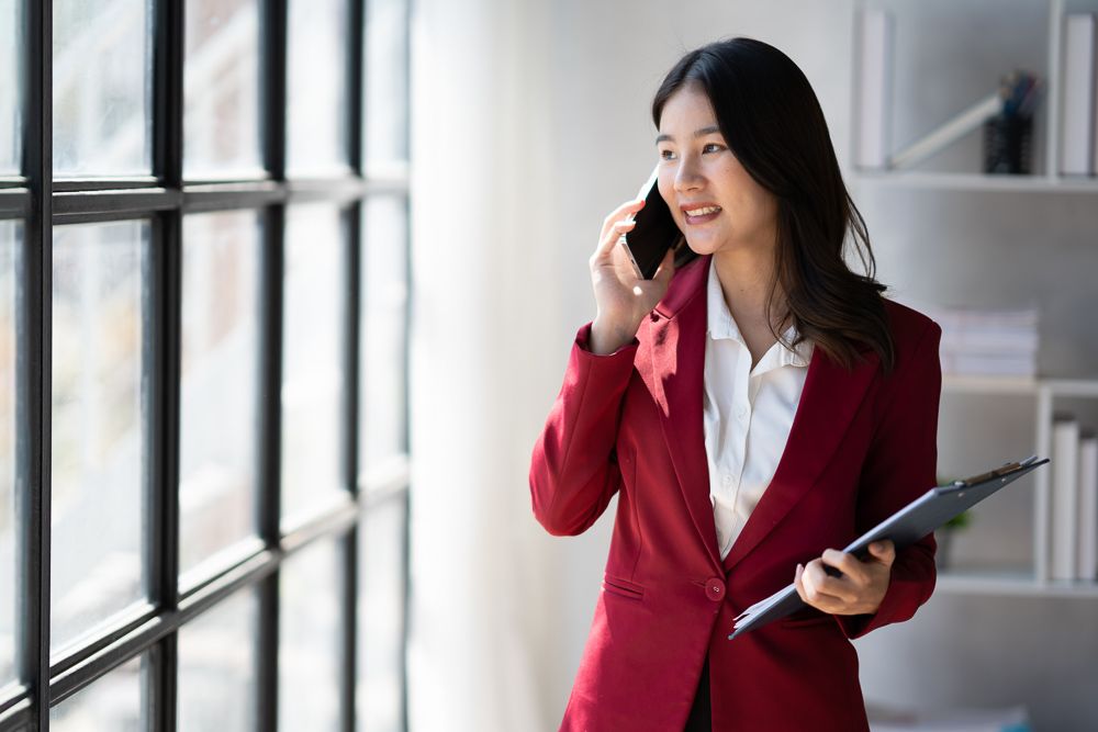 glass-modern-office-interior-design-with-woman-talking-on-phone