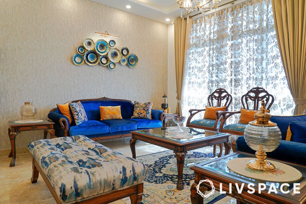 interior-design-cost-in-ghaziabad-for-living-room-blue-sofa-wall-art