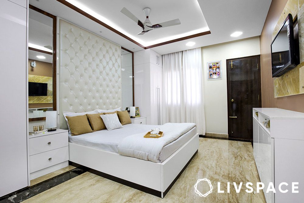 white-bedroom-with-headboard-wall-granite-flooring-false-ceiling