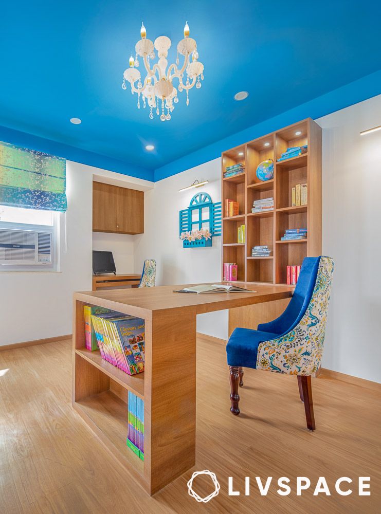bright-blue-walls-wooden-study-table-and-bookshelf-design