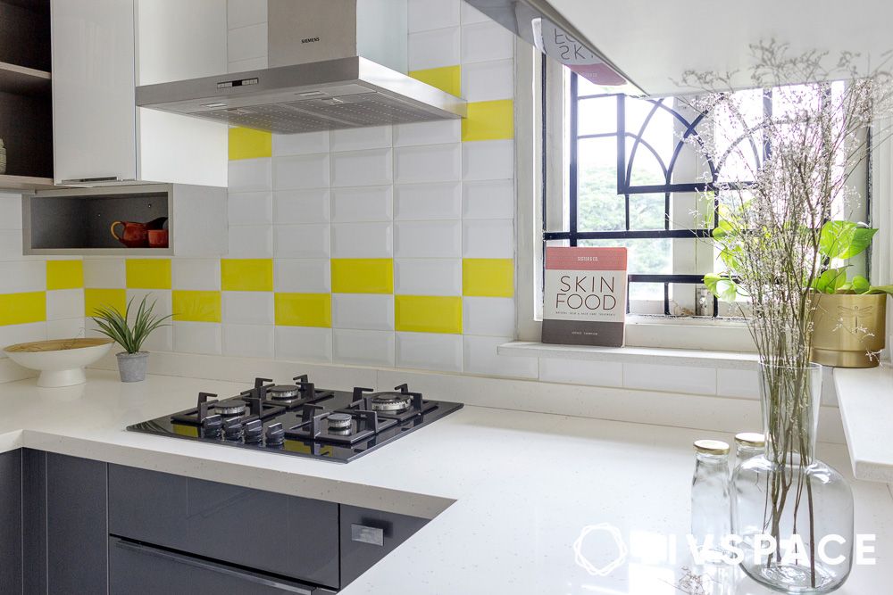 pops-of-yellow-backsplash-with-white-countertops