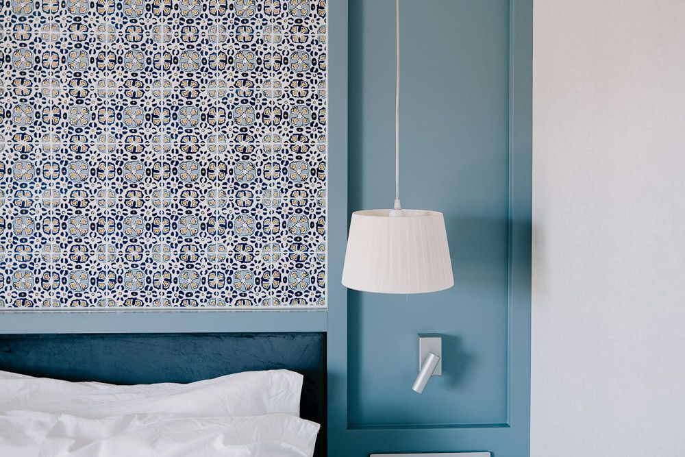 blue floral wallpaper and sky blue bedroom wall