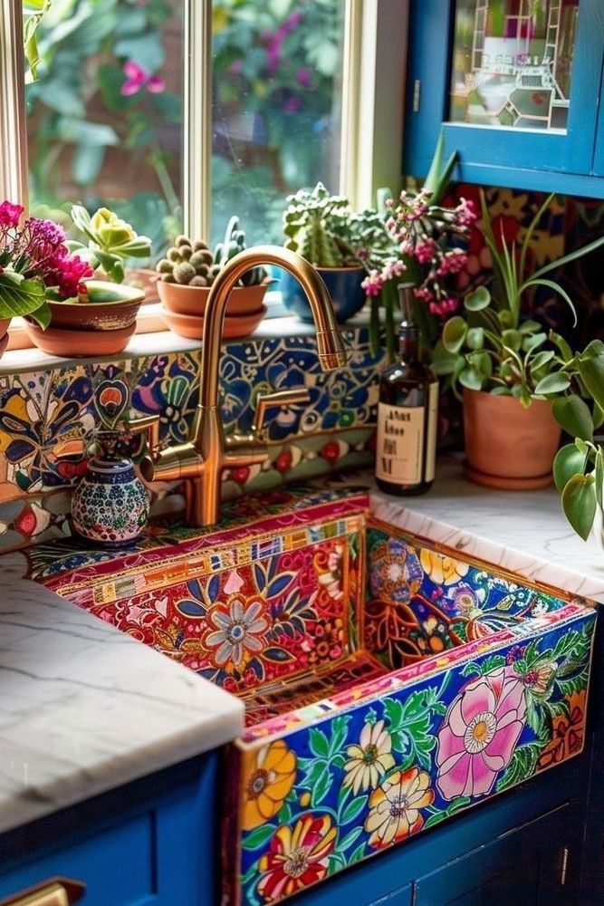colourful bohemian kitchen sink surrounded by plants