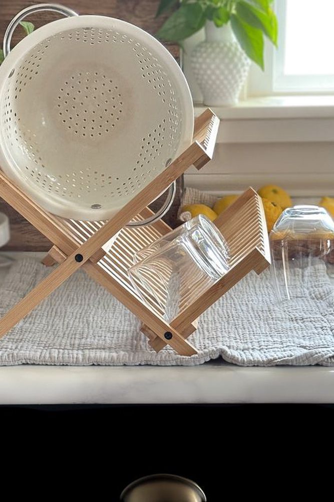 wooden statement dish rack decor with plates and glasses