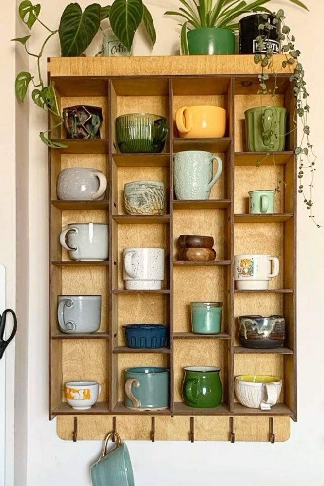 a wooden shelf displaying a mug collection