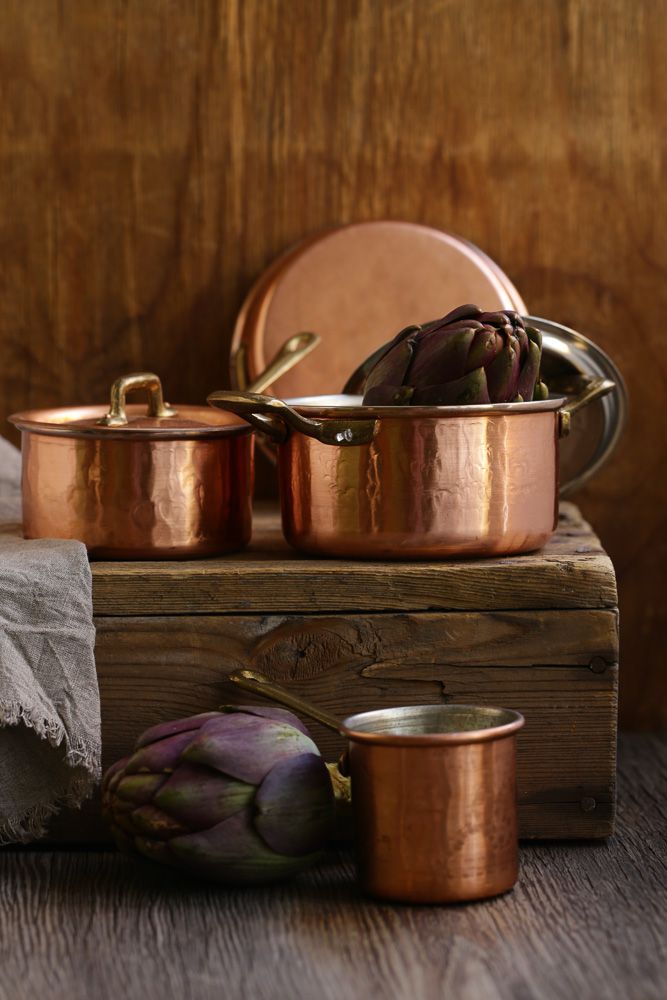 brass and copper pots decor with artichokes