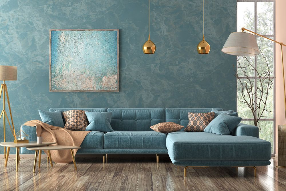 modern luxury modern living room design with blue sofa and textured wall paint
