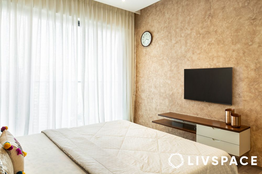 gold textured wallpaper in bedroom