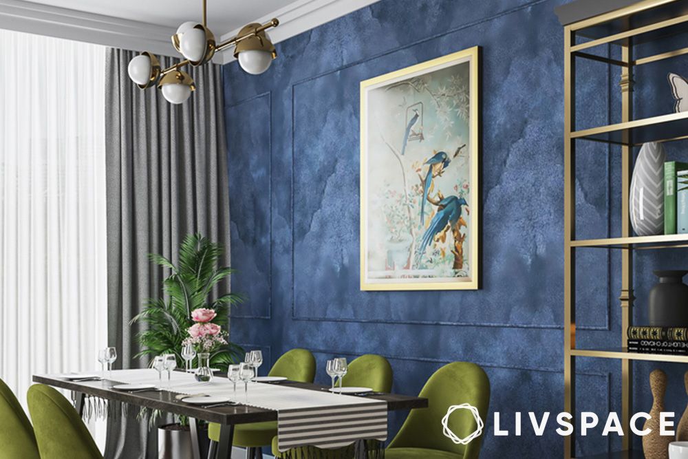 blue textured wallpaper in dining room with green chairs