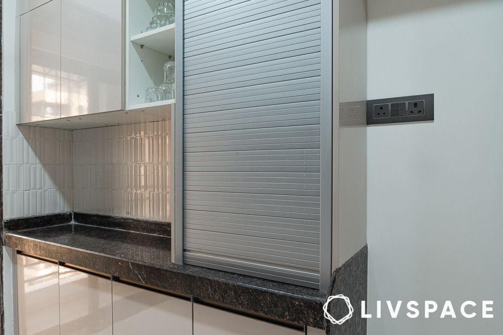 a sliding pull down shutter storage cabinet