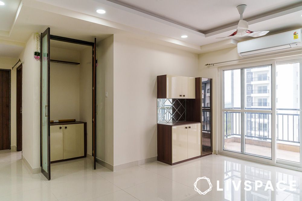 pooja unit with frosted glass in dining area
