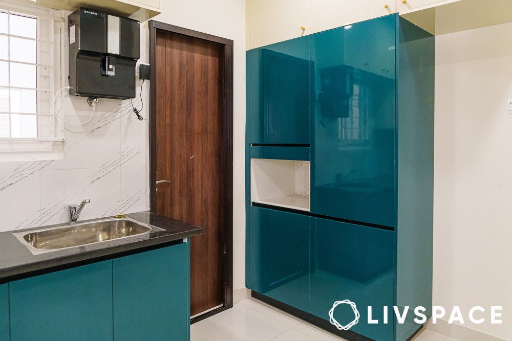 blue coloured cabinets in my home tridasa kitchen
