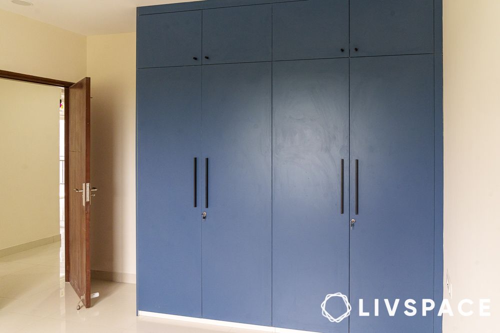 blue coloured wardrobe in my home tridasa bedroom