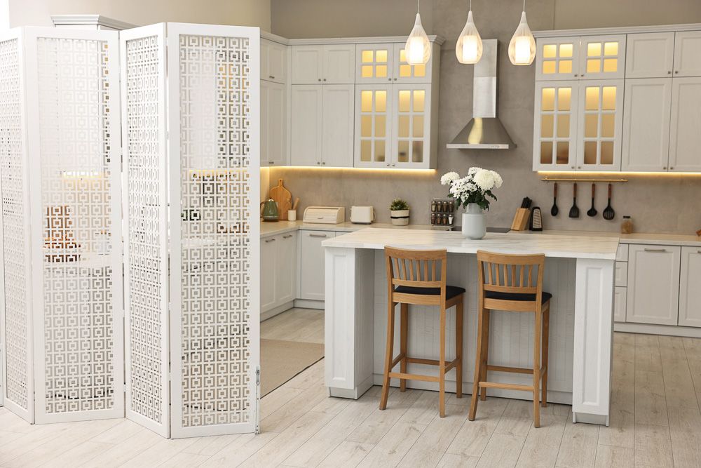 white folding screen as kitchen divider