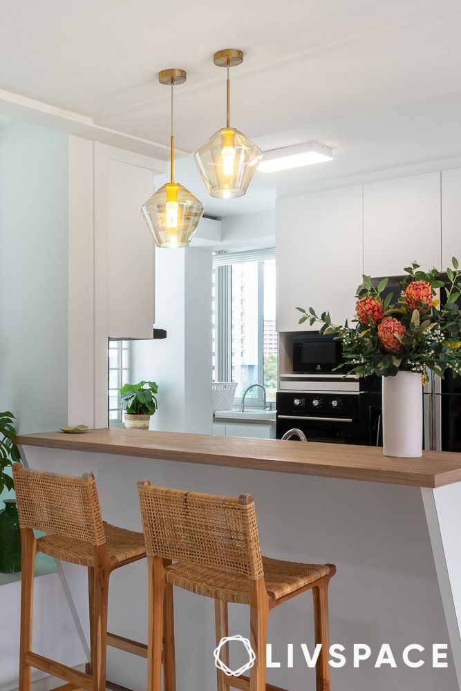 two wooden chairs in a kitchen counter