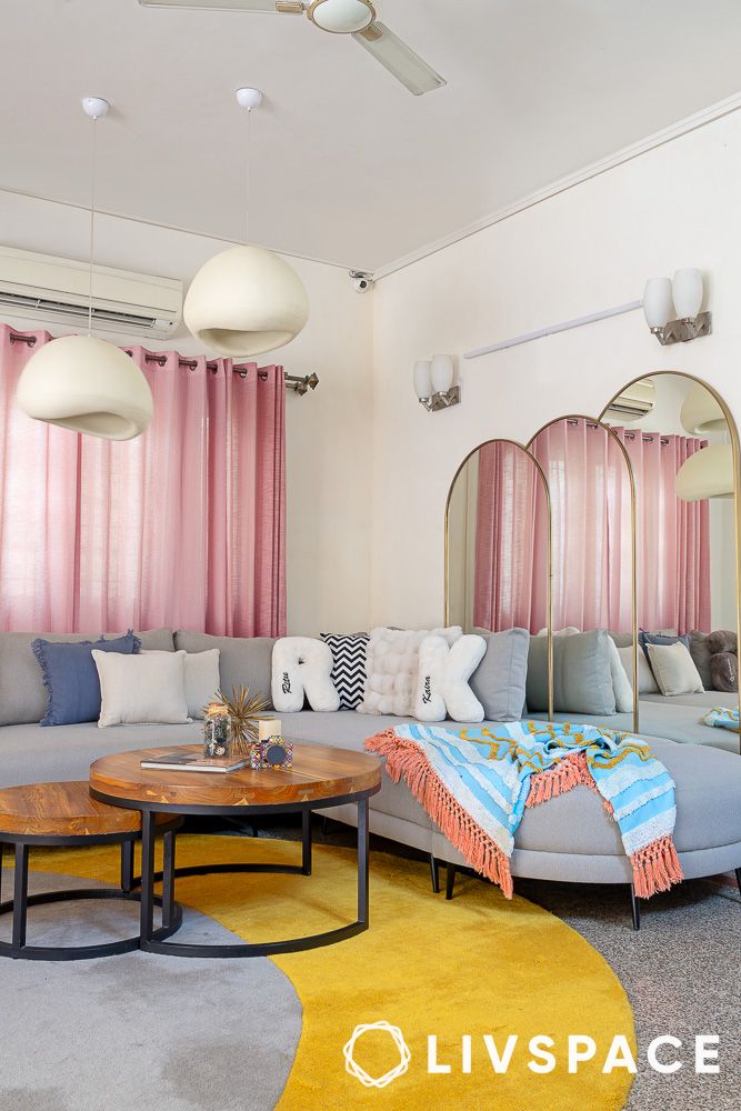 white mushroom pendant lights above coffee table in living room