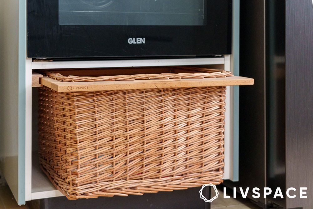 Pull out wicker basket in a kitchen for smart storage