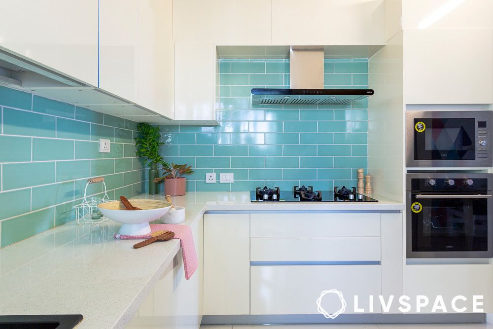 glossy white kitchen design with aqua blue backsplash