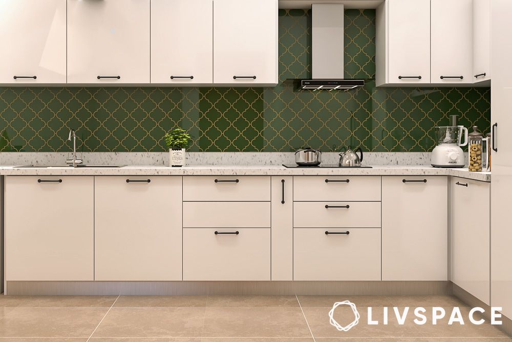 white kitchen design with green glass backsplash
