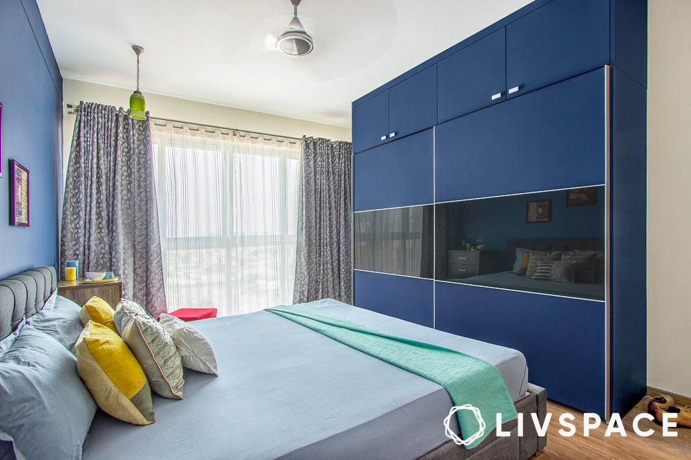 dark blue wardrobe with sliding doors and tinted glass 1